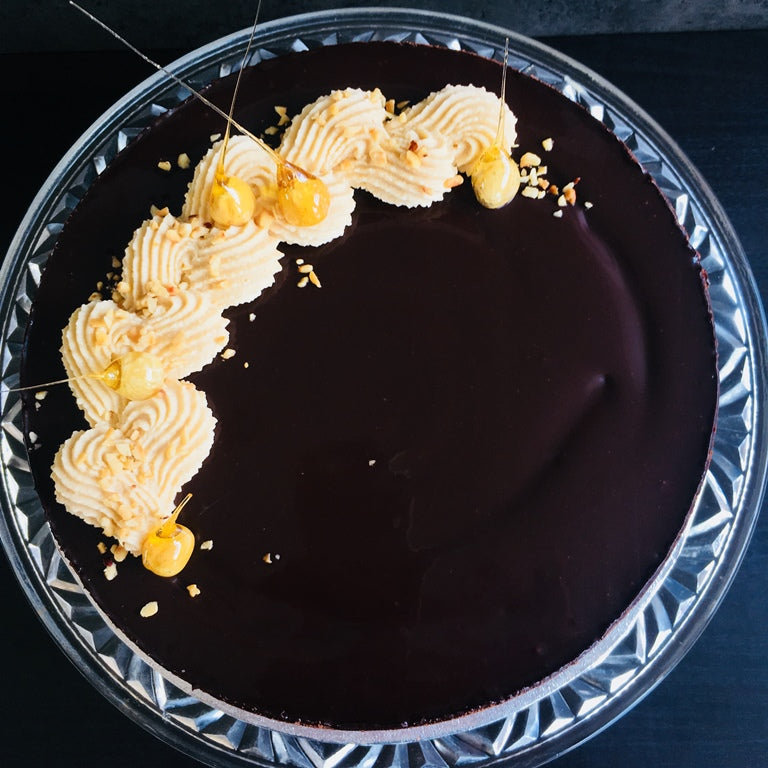 Top view of a Torta Setteveli chocolate cake with hazelnut mousse and chocolate sponge layers. Made by Italian bakery Biscotti di Debora of Cambridge.