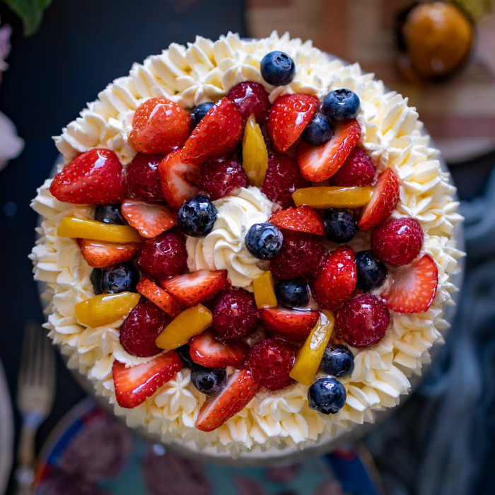 Top view of a fresh fruit and vanilla cake made by Biscotti di Debora of Cambridge