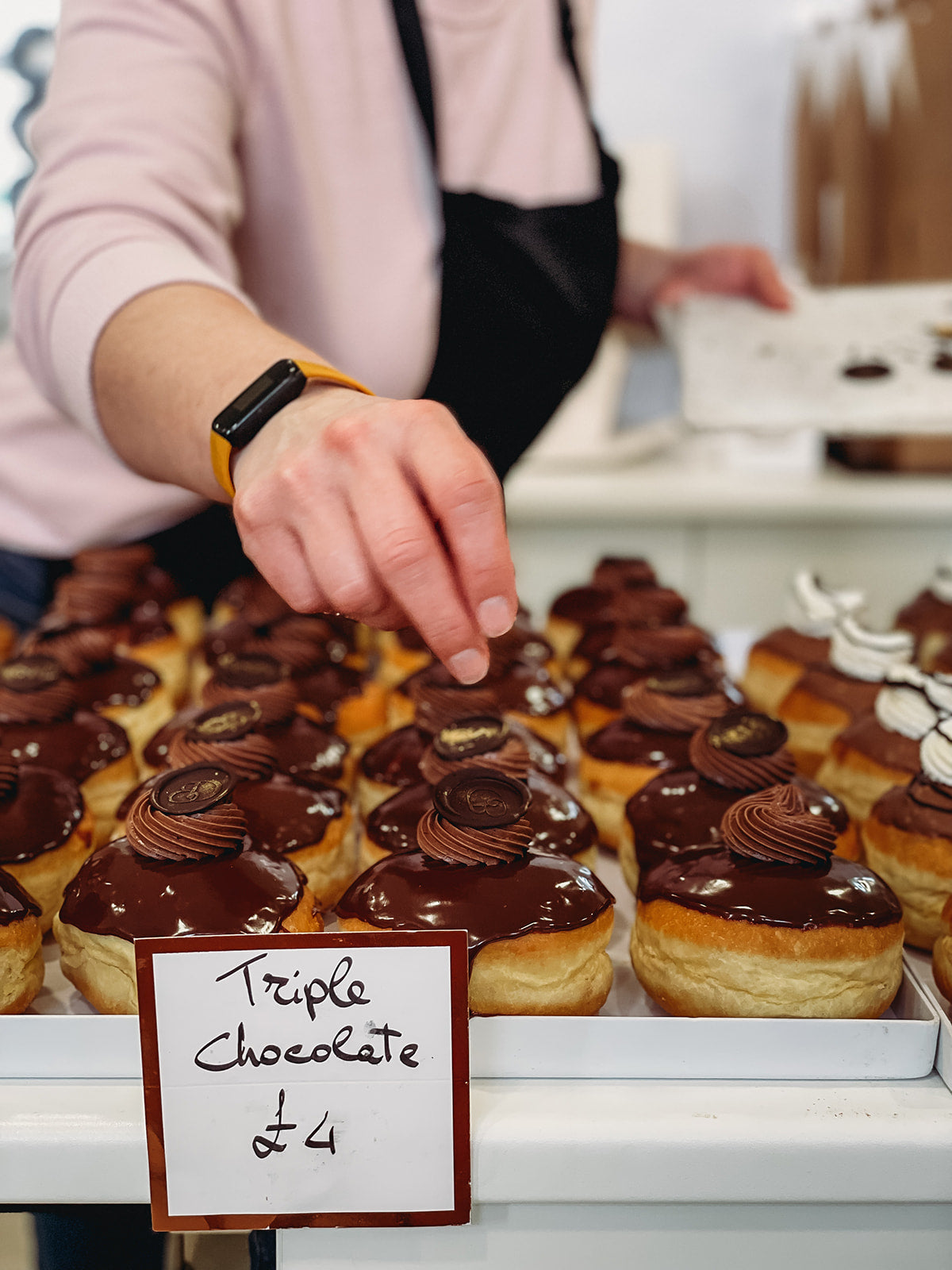 Close up of a tray of freshly baked Triple Chocolate Doughnuts.